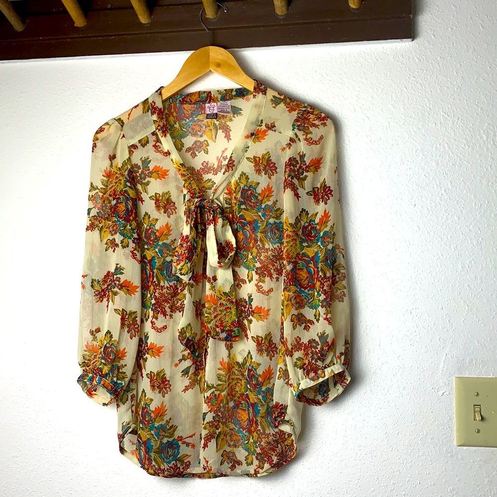 Sheer floral blouse with bow necktie in the front